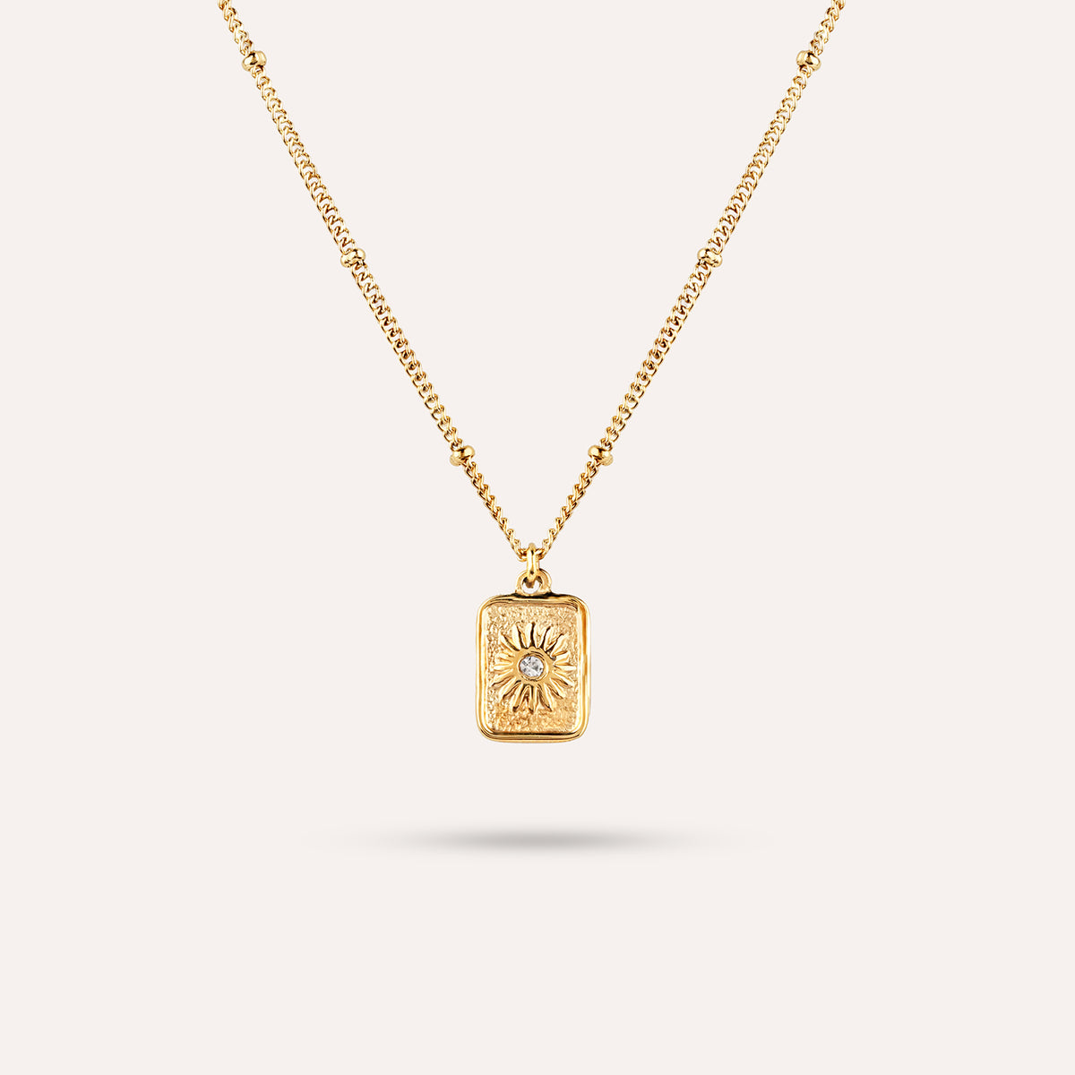 Elios Pendant Necklace | Sunburst Tag Gold-Tone Chain